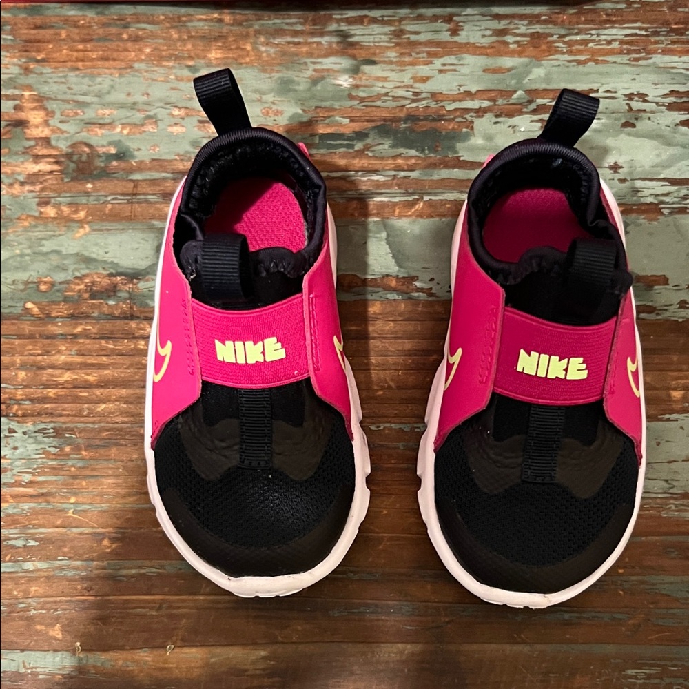 Nike Kids Pink and Black Slip-On Sneakers with Yellow Swoosh